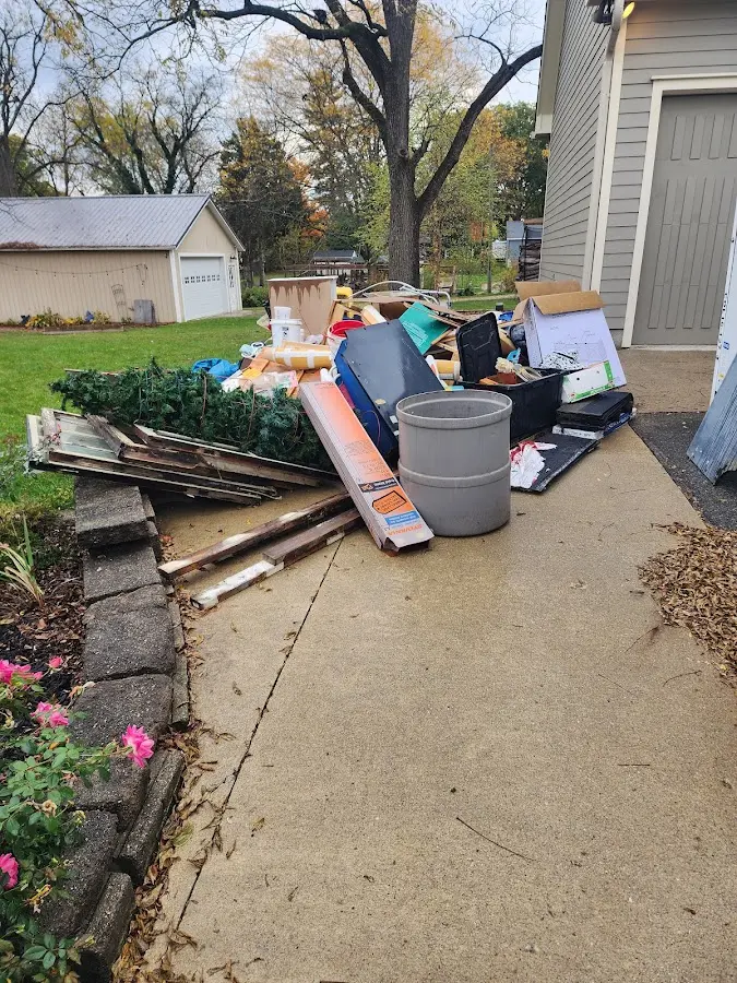 Dumpster being loaded with debris for Commercial Dumpster Rental in Marysville